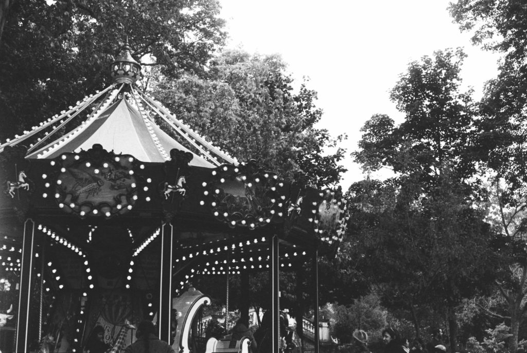 A carousel in Paris, France photographed in Kodak Tri-x 400 film on a Pentax 35mm camera. Photo by Holly Michon Photography. 