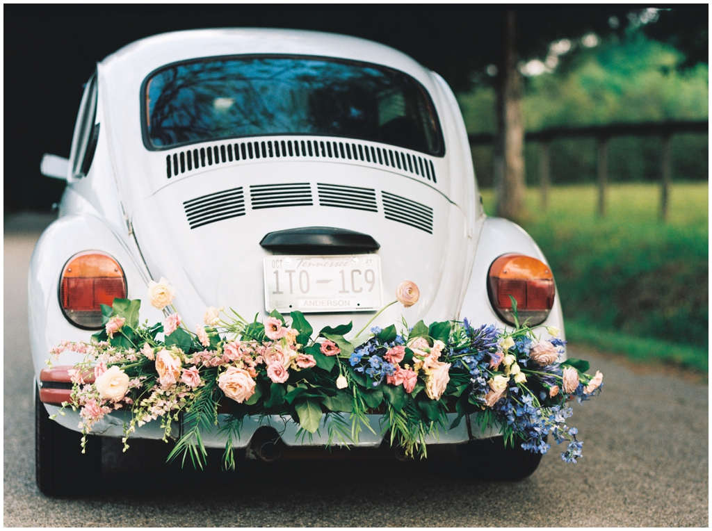 Vintage Volkswagen Beetle with Luscious Wedding Floral Arrangement