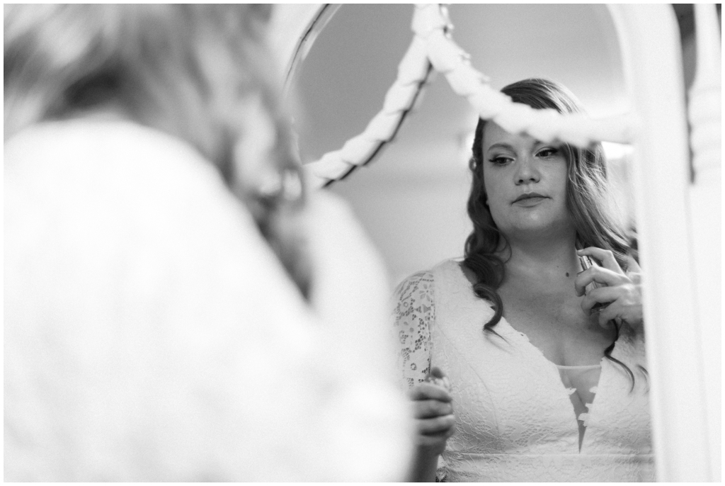 Bride getting ready in her classic, vintage inspired lace wedding gown - Holly Michon Photography