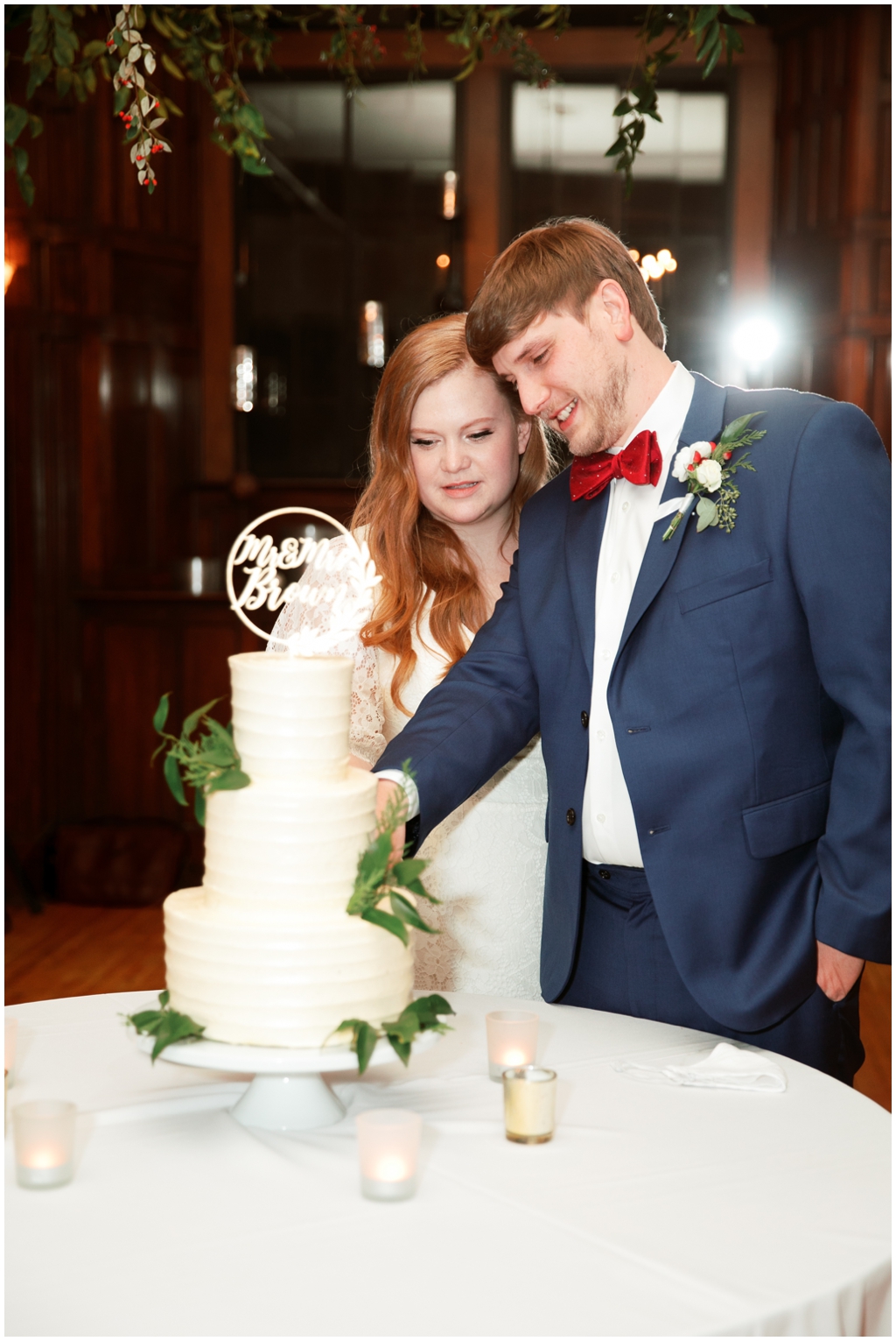 Bride and groom cut their cake at Asheville winter wedding 