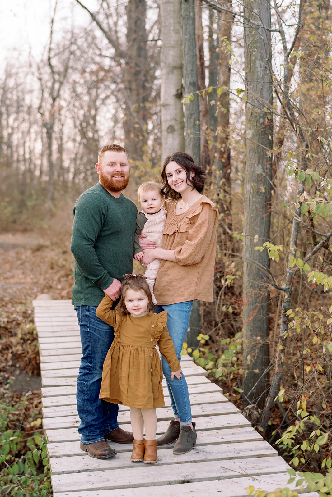 Young family of four with newborn family autumn photo session in Knoxville, TN by Holly Michon Photo