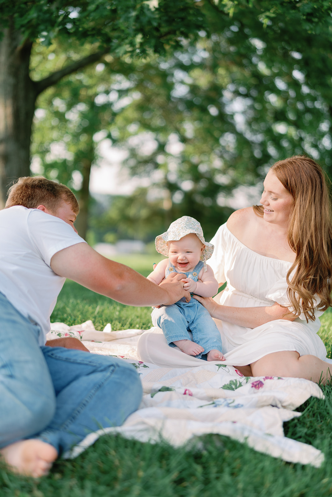 A warm and bright Knoxville countryside family photo shoot of a six month baby and her mom and dad.