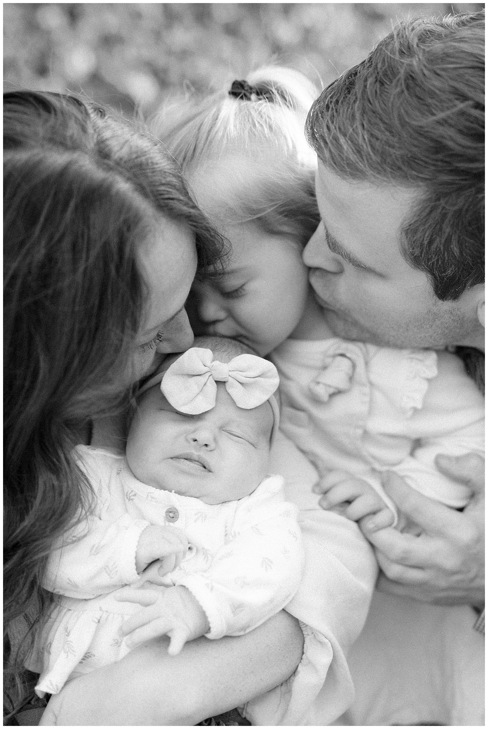 Black and white film photo of adorable family of four in Knoxville, TN.