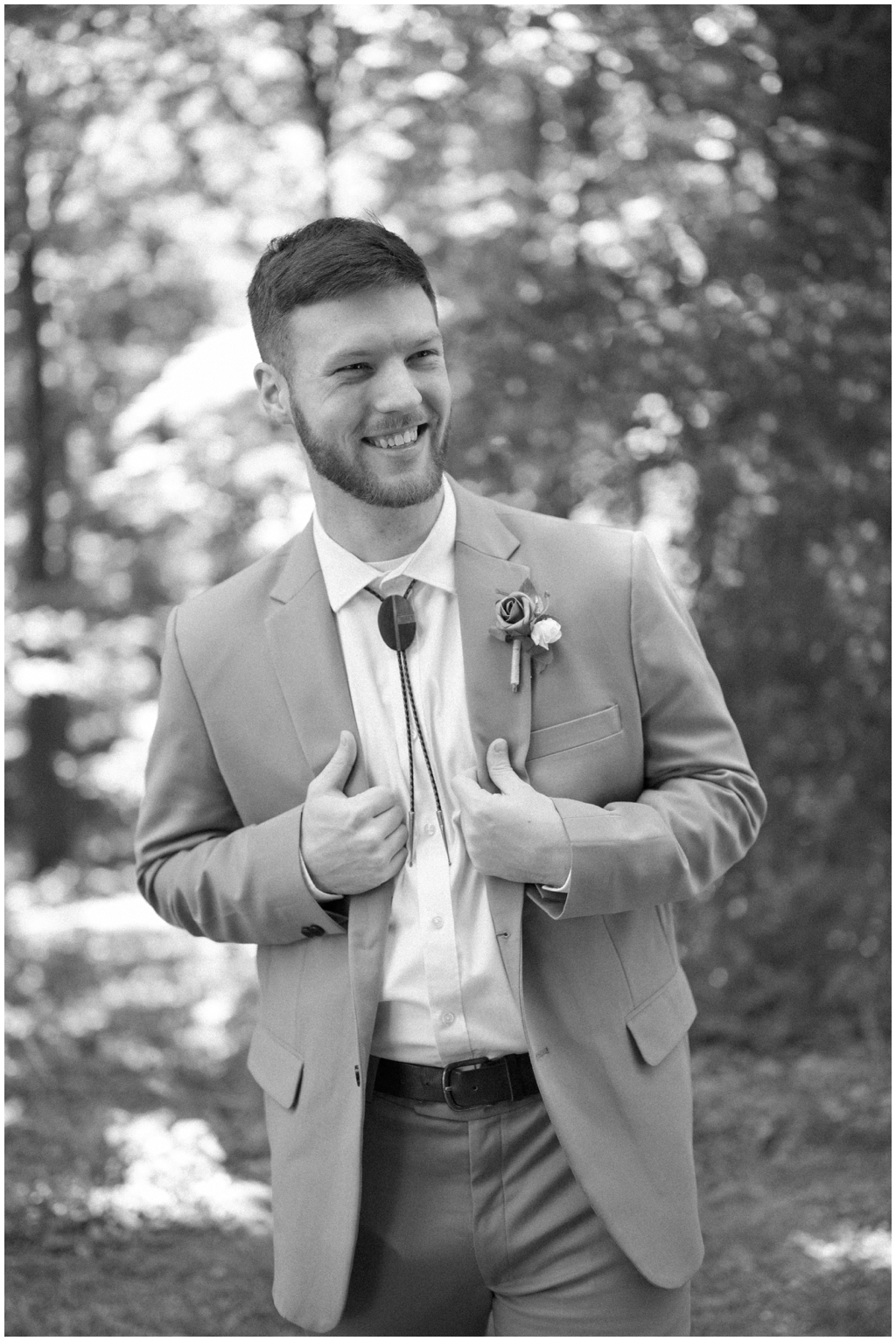 Groom smiling in portrait for vivid and colorful Knoxville wedding.