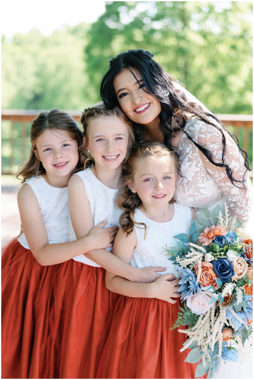 Bride smiles with sweet children in sentimental Knoxville wedding.