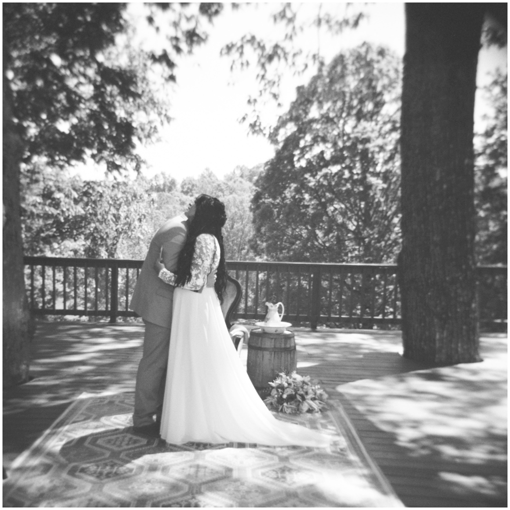 Black and white film image of bride and groom sharing a sweet moment together in sentimental East Tennessee wedding.