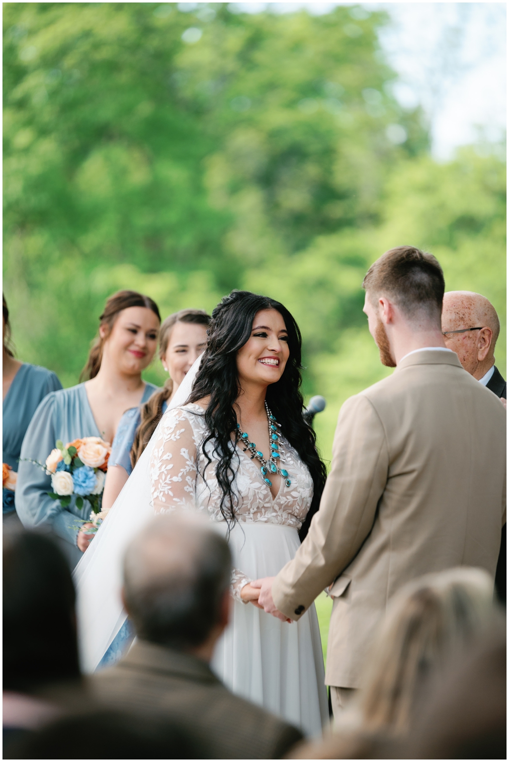 Bride smiles at groom in colorful image of sentimental Knoxville wedding.