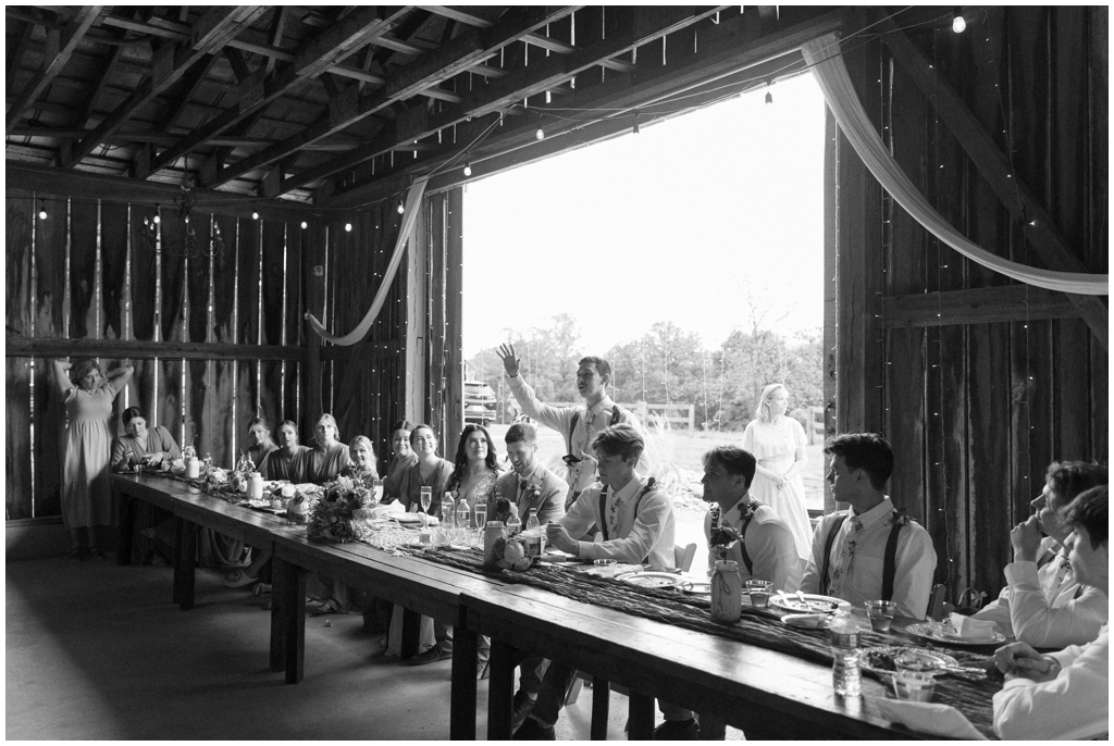 Member of wedding party shares speech during wedding reception at Knoxville wedding.