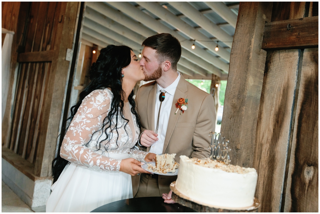 Bride and groom share kiss at wedding reception for Knoxville, TN spring wedding.