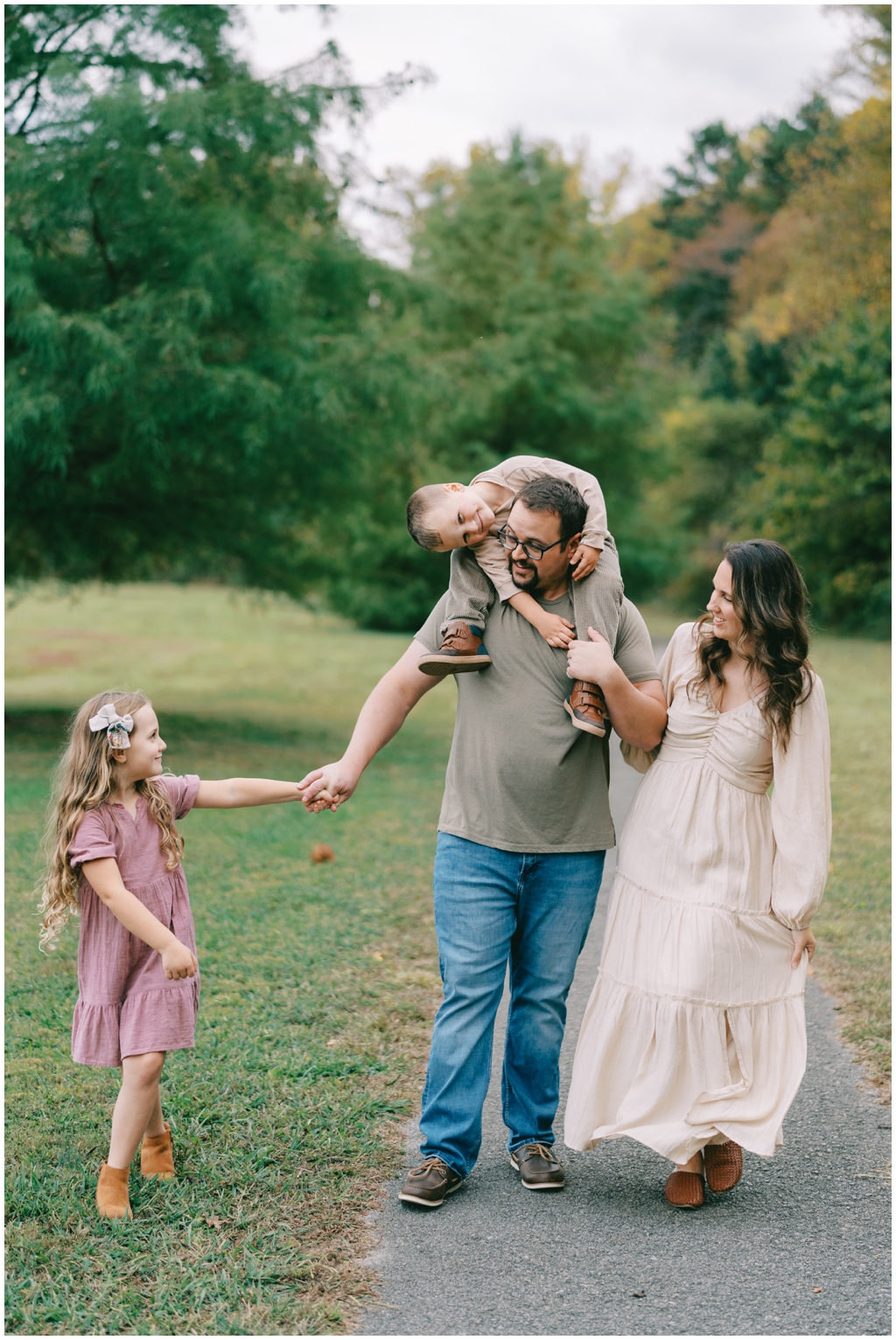 Family snuggles and plays together during fall family session in Knoxville, TN.