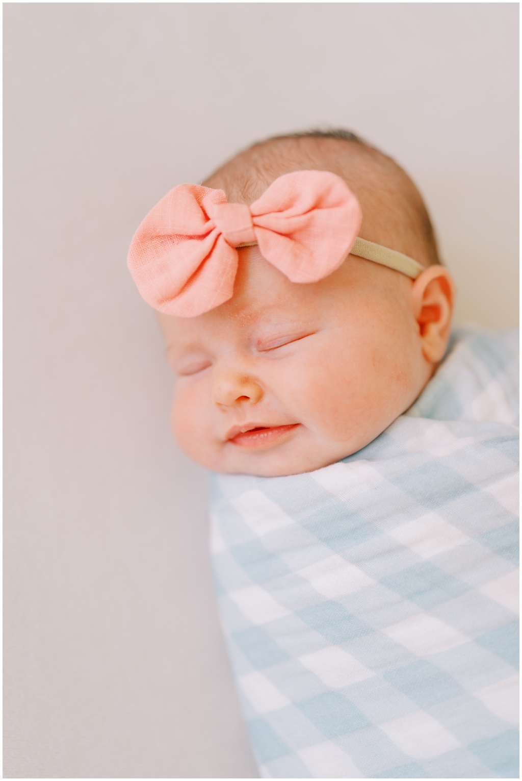 Newborn swaddled in blanket during photography session in Knoxville, TN.