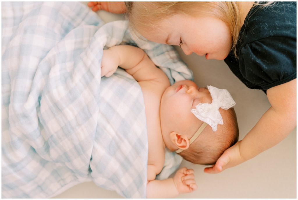 Adorable sister duo during quaint and intimate newborn session in Knoxville, TN.