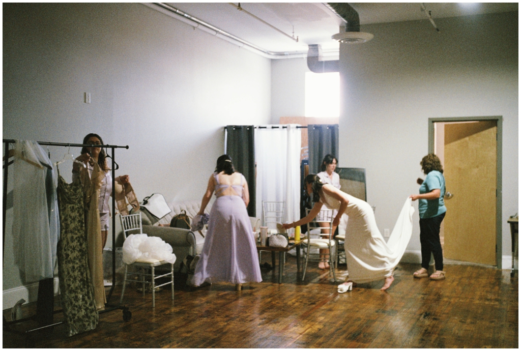 Bride getting ready in suite with bridesmaids at Skyview venue in Maryville, TN.