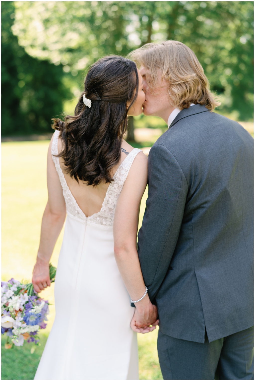 Bride and groom share a kiss for classy and romantic wedding in Maryville, TN.