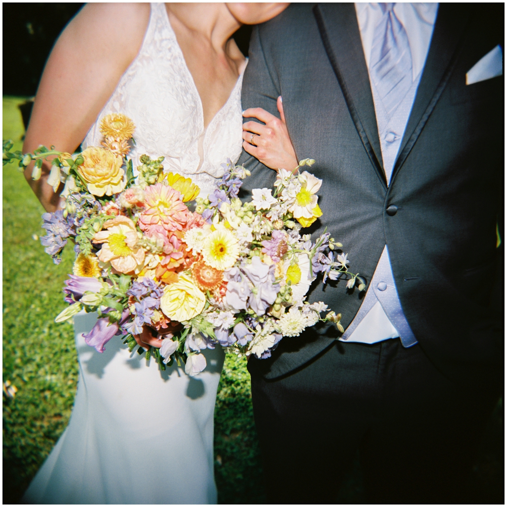 Film image pf bride leaning on groom at Maryville, TN park.