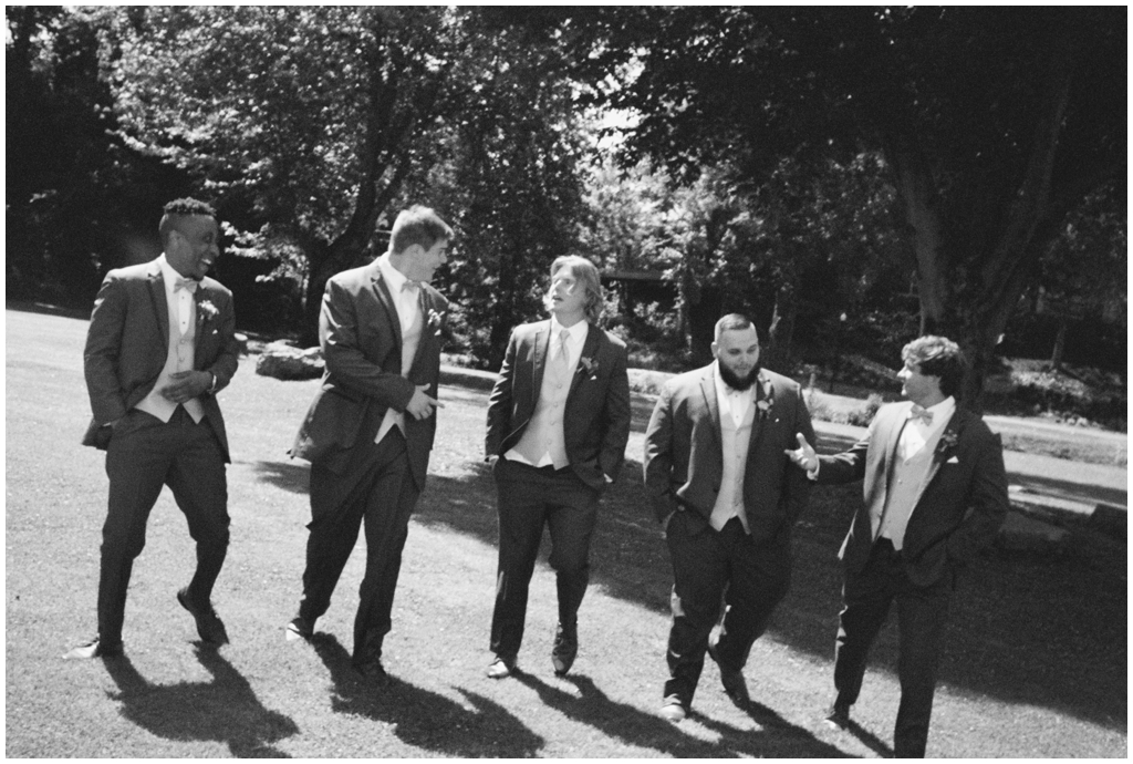 Black and white film image of groom and groomsmen at classy and romantic summer Maryville, TN wedding.