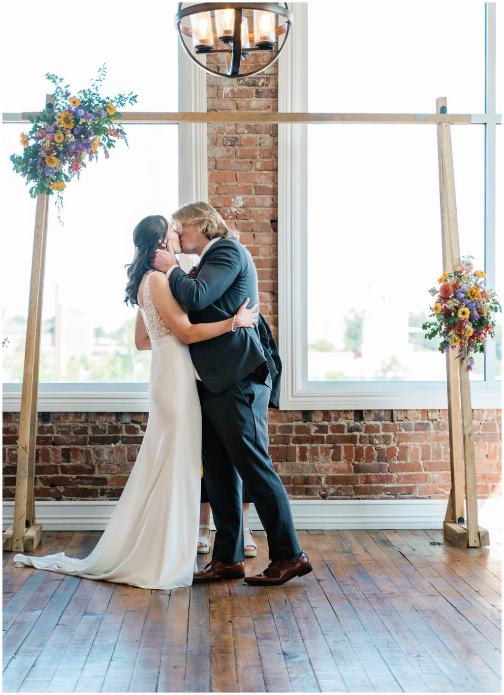 Bride and groom kiss at the end of the ceremony at Skyview venue in Maryville, TN.