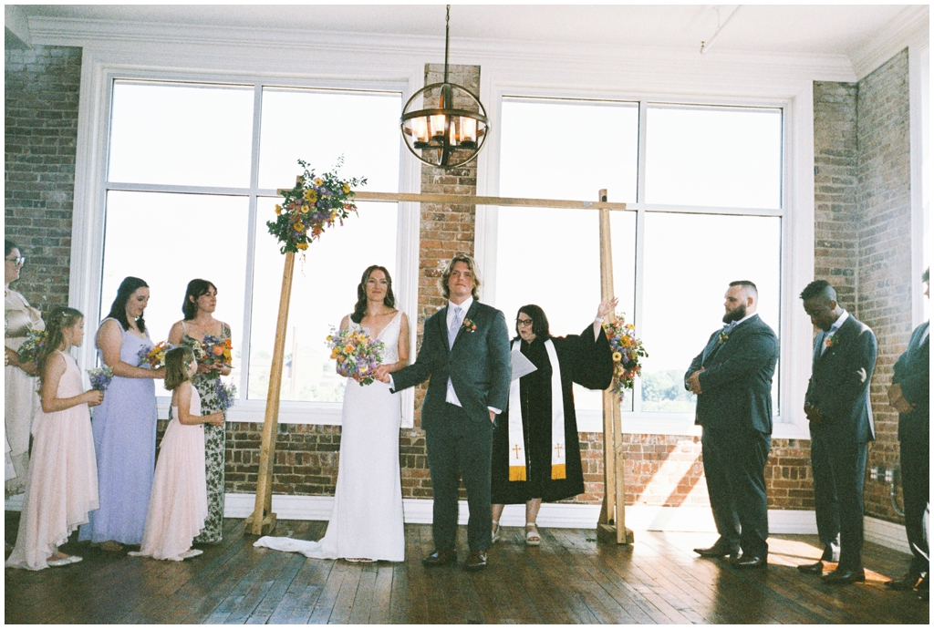 Film image of bride and groom leaving ceremony at Skyview venue in Maryville, TN.