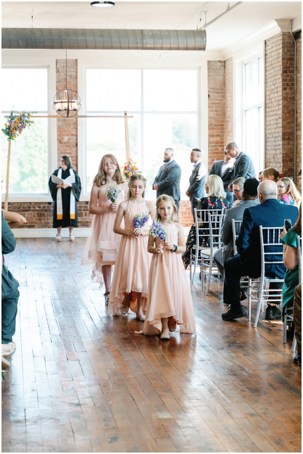 Flower girls walk down the aisle at classy and romantic Maryville, TN wedding.