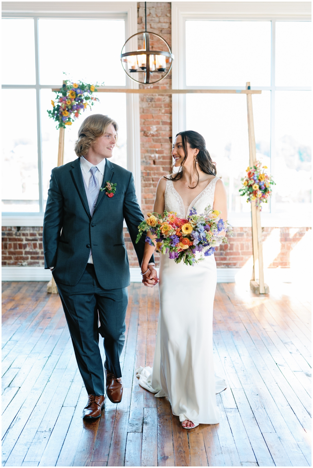 Bride and groom look at each other lovingly after ceremony in Maryville, TN.