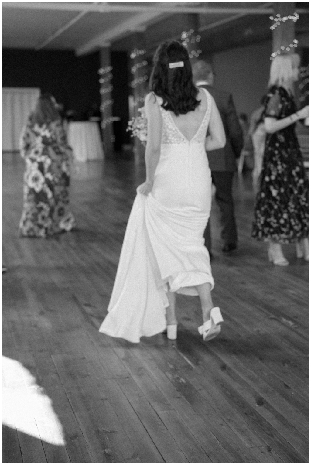 Black and white film image of bride walking in Maryville, TN wedding.