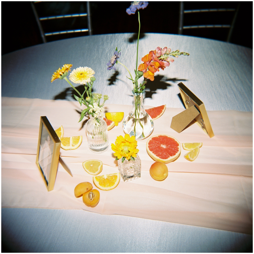 Film detail image of the table arrangements for the reception of classy and romantic wedding in Maryville, TN.