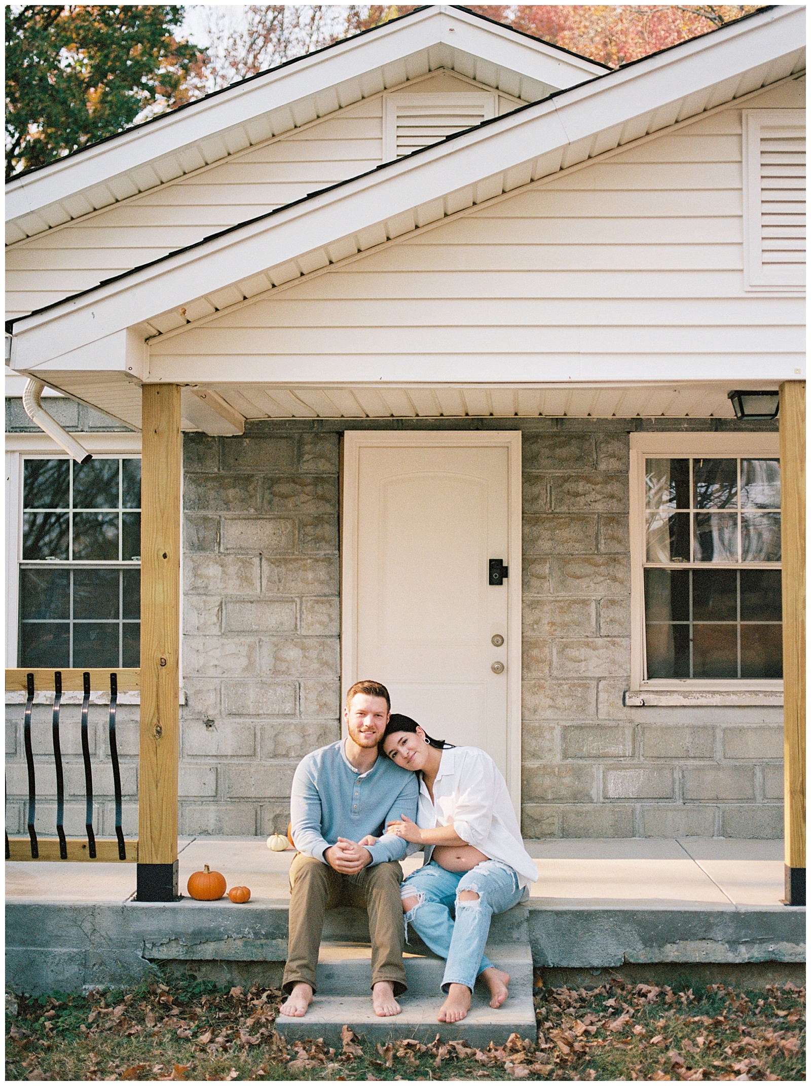 Mom and dad sit on front steps of their first home during Knoxville maternity session.