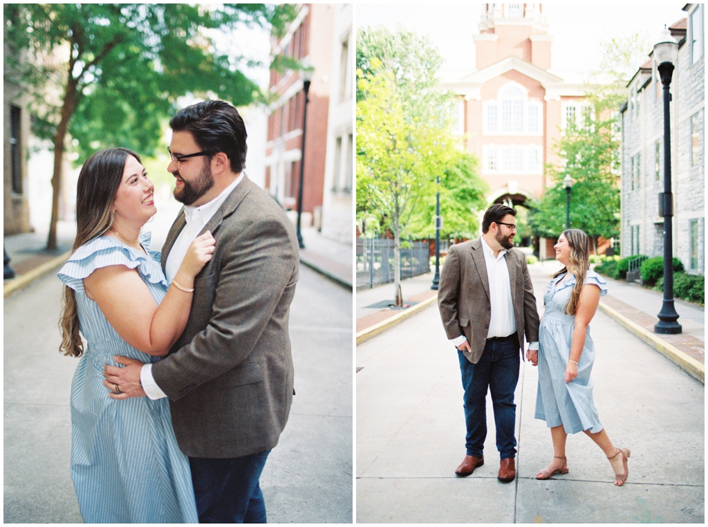 Husband and wife pose in urban downtown knoxville during summer anniversary session.