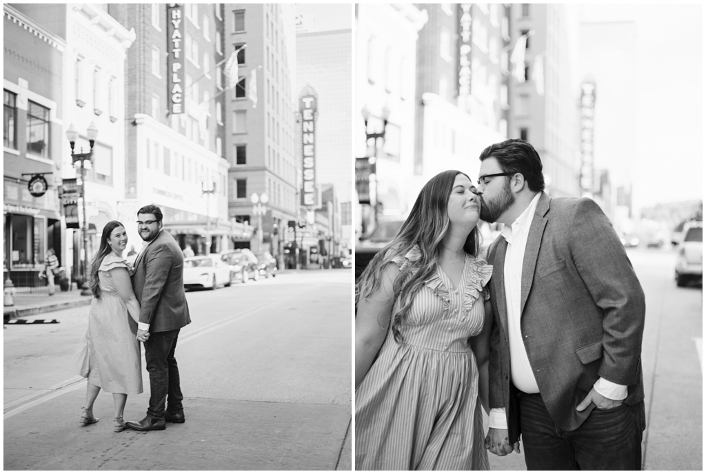 Black and white image of husband and wife posing in front of the Tennessee Theater sign in downtown knoxville