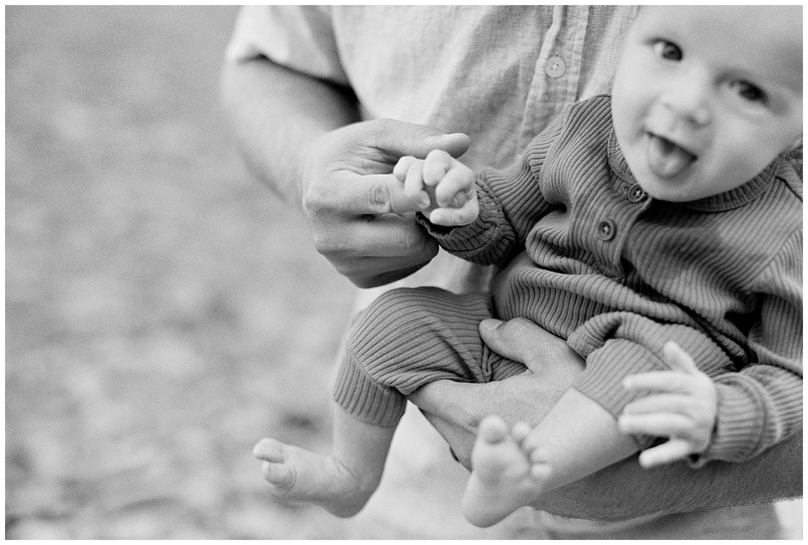 Black and white image of newborn during Lake Michigan relaxed family session