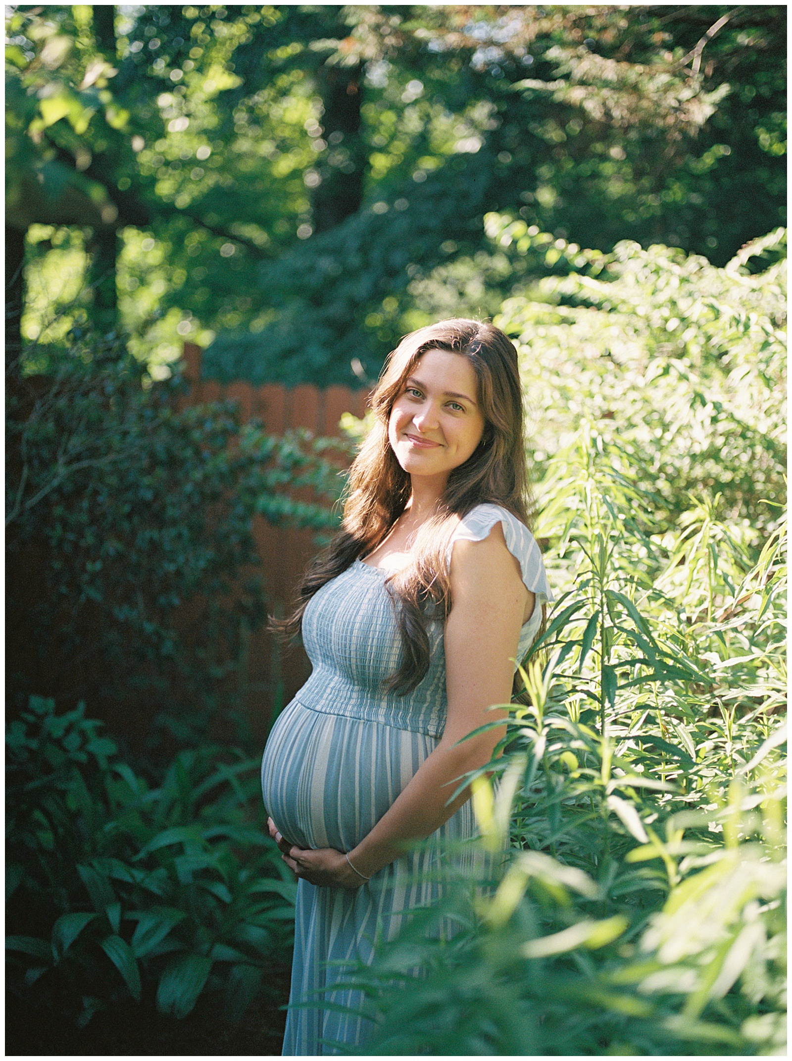 Stunning mother poses in front yard during Knoxville maternity session