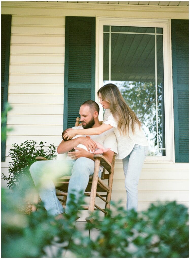 At home lifestyle newborn session on the family's front porch in Knoxville by Holly Michon Photography.
